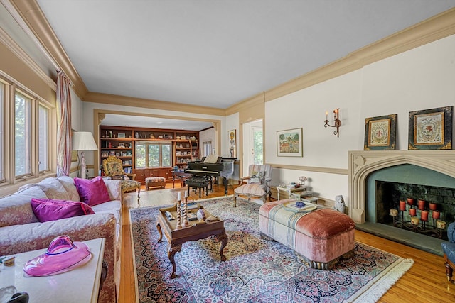 1 Wensley Dr, Great Neck, NY 11021 - living room with crown molding, wood finished floors, and a fireplace with raised hearth