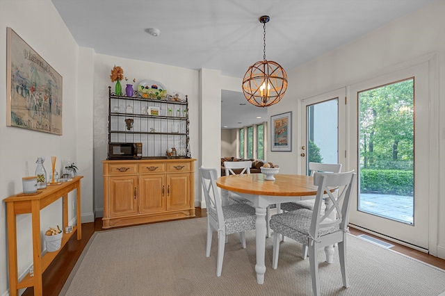 1 Wensley Dr, Great Neck, NY 11021 - dining area with a chandelier and plenty of natural light