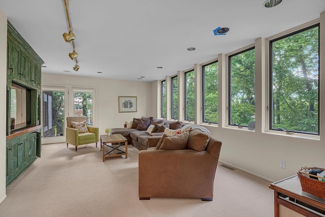1 Wensley Dr, Great Neck, NY 11021 - living room featuring light carpet, track lighting, and baseboards