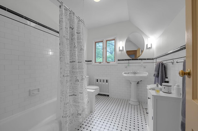 1 Wensley Dr, Great Neck, NY 11021 - full bath featuring radiator heating unit, shower / bath combo with shower curtain, tile walls, toilet, and a wainscoted wall