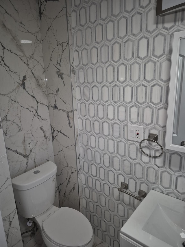 12702 97th Ave, Richmond Hill S, NY 11419 - bathroom with tile walls and toilet