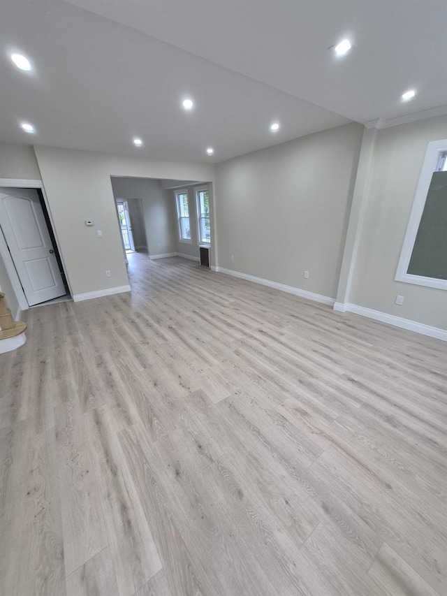 12702 97th Ave, Richmond Hill S, NY 11419 - unfurnished living room featuring light wood-type flooring, baseboards, and recessed lighting