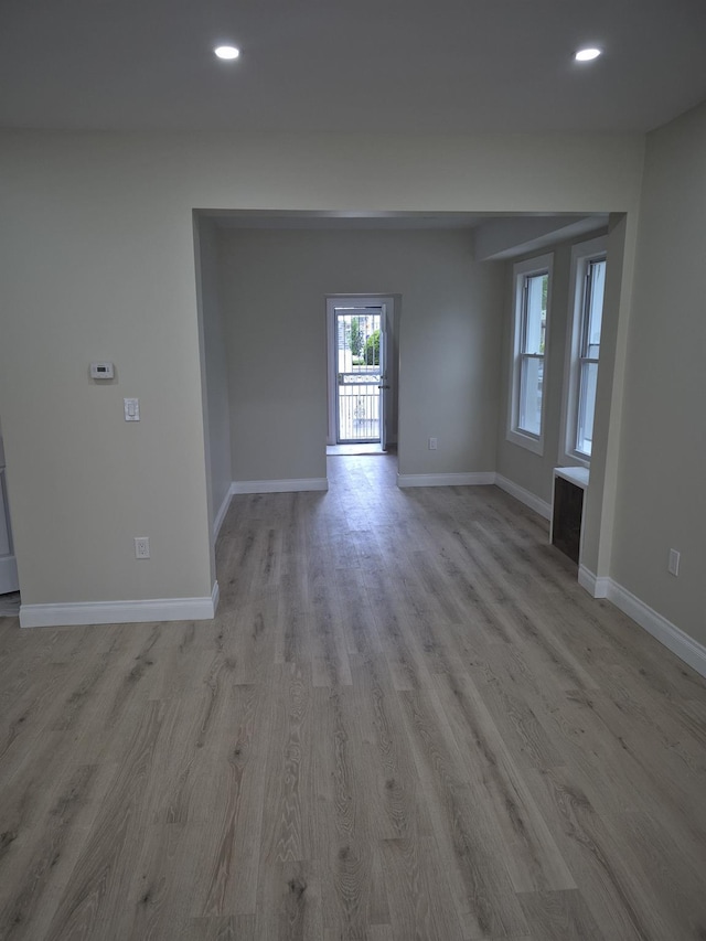 12702 97th Ave, Richmond Hill S, NY 11419 - empty room with baseboards, light wood-style flooring, and recessed lighting