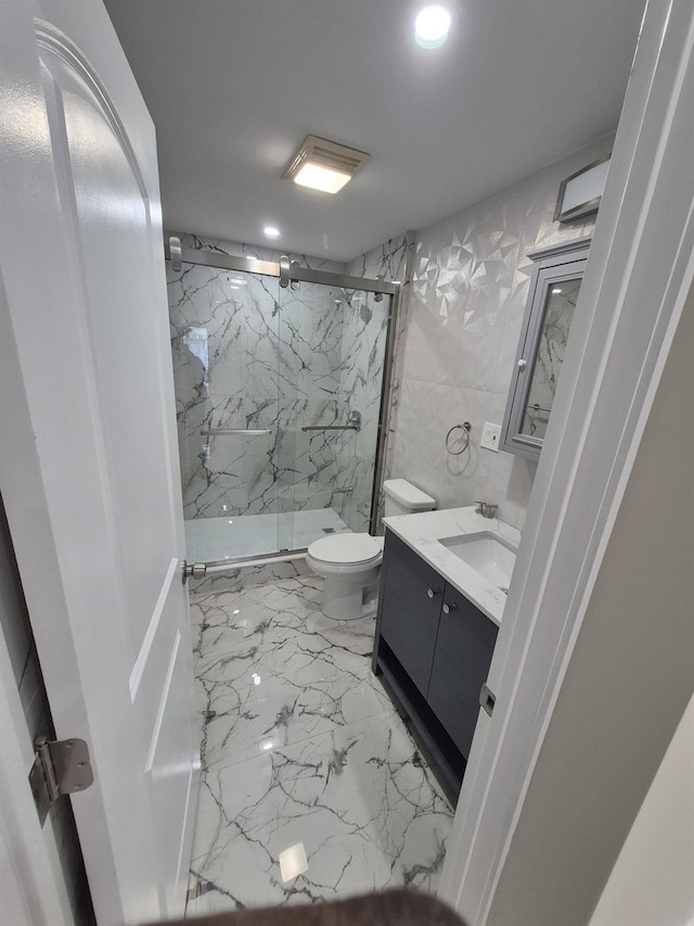 12702 97th Ave, Richmond Hill S, NY 11419 - bathroom featuring marble finish floors, toilet, a marble finish shower, vanity, and recessed lighting