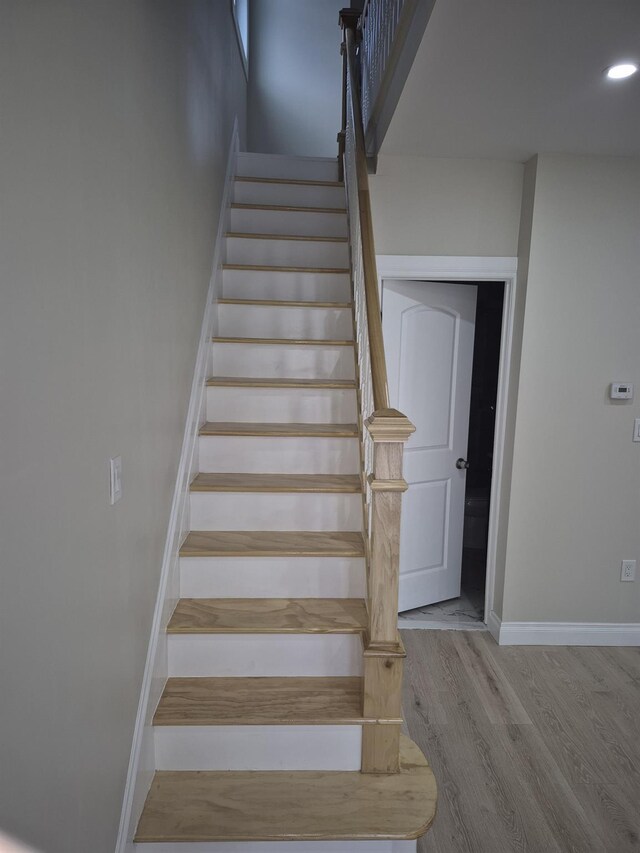 12702 97th Ave, Richmond Hill S, NY 11419 - stairs featuring wood finished floors, baseboards, and recessed lighting