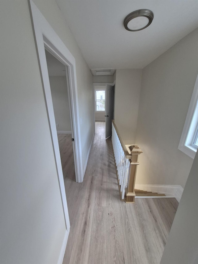 12702 97th Ave, Richmond Hill S, NY 11419 - corridor with an upstairs landing, light wood-type flooring, baseboards, and attic access