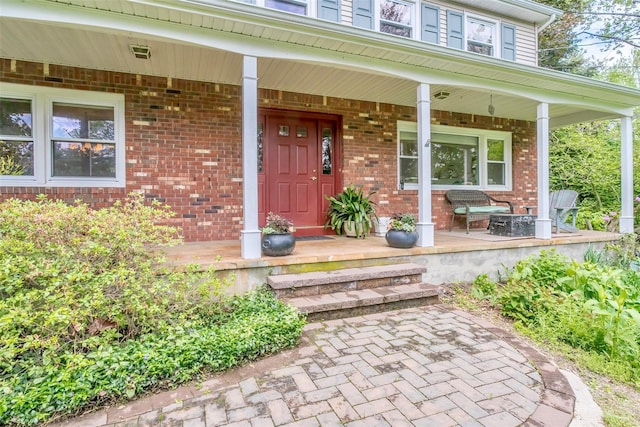24 Overhill Ln, Warwick, NY 10990 - doorway to property featuring covered porch and brick siding