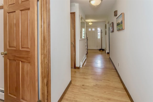 24 Overhill Ln, Warwick, NY 10990 - hall with a baseboard radiator, light wood-style floors, and baseboards
