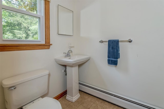 24 Overhill Ln, Warwick, NY 10990 - bathroom featuring a baseboard radiator, toilet, tile patterned floors, and baseboards
