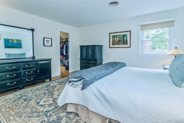 24 Overhill Ln, Warwick, NY 10990 - bedroom featuring a spacious closet, wood finished floors, baseboards, and a closet