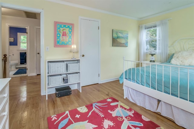 24 Overhill Ln, Warwick, NY 10990 - bedroom with ornamental molding, wood finished floors, and baseboards