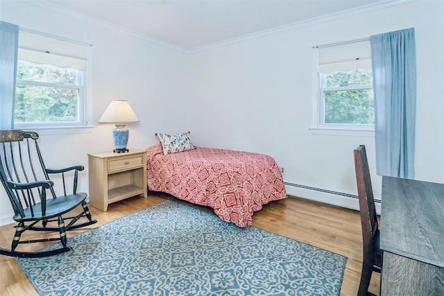 24 Overhill Ln, Warwick, NY 10990 - bedroom with baseboard heating, ornamental molding, and wood finished floors