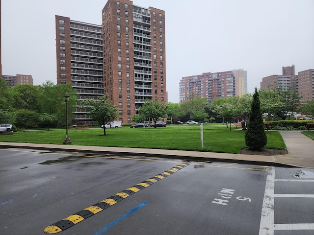 61-35 98th St Unit 4J, Rego Park, NY 11374 - view of property featuring uncovered parking and a view of city