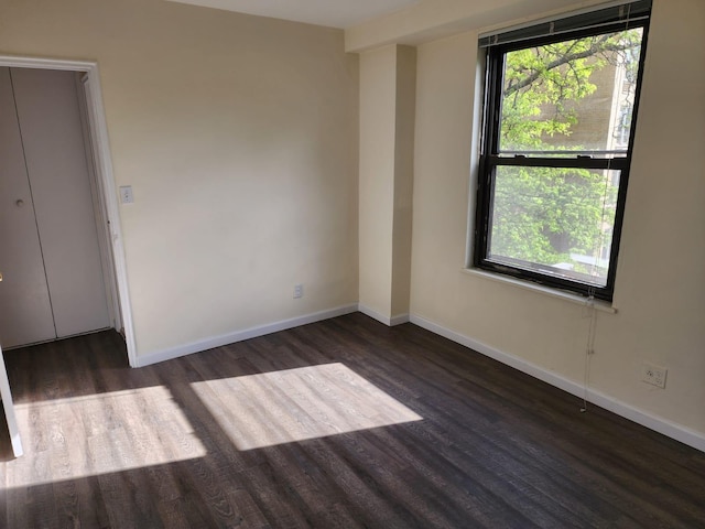 61-35 98th St Unit 4J, Rego Park, NY 11374 - unfurnished room with wood finished floors and baseboards