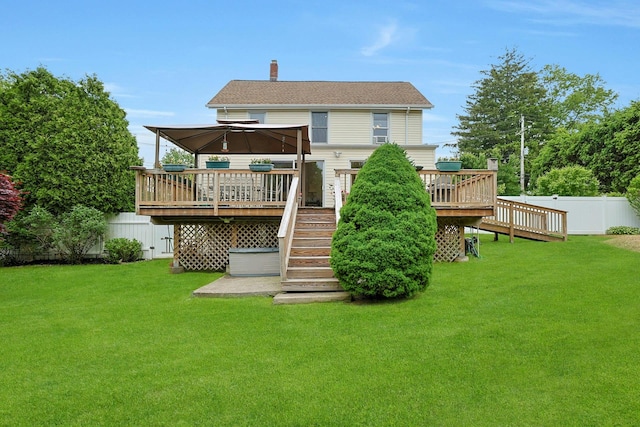 rear view of property featuring stairway, a gazebo, a deck, and a chimney