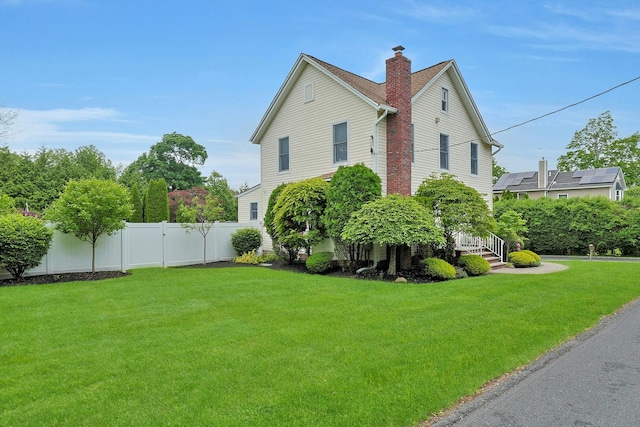 view of property exterior featuring a chimney