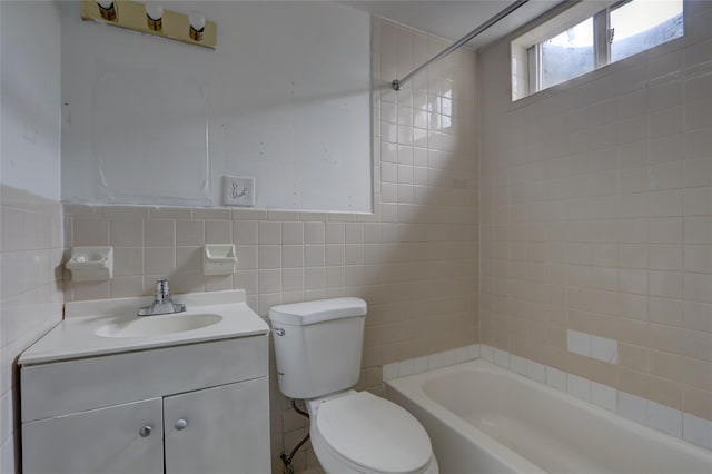 122-52 Springfield Blvd, Springfield Gardens, NY 11413 - bathroom featuring tile walls, toilet, vanity, and shower / bathtub combination