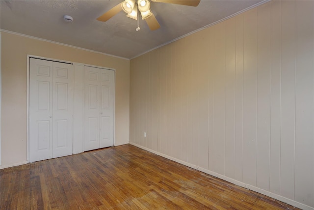 122-52 Springfield Blvd, Springfield Gardens, NY 11413 - unfurnished bedroom with hardwood / wood-style flooring, a ceiling fan, a closet, crown molding, and baseboards