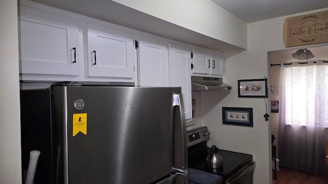 1115 Cherry Hill Dr, Poughkeepsie, NY 12603 - kitchen featuring freestanding refrigerator, under cabinet range hood, electric range, white cabinetry, and wood finished floors