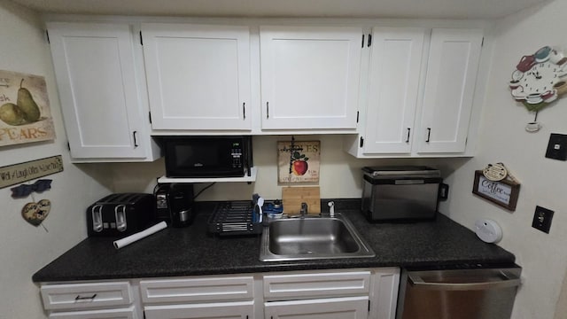 1115 Cherry Hill Dr, Poughkeepsie, NY 12603 - kitchen featuring black microwave, a sink, white cabinets, and stainless steel dishwasher