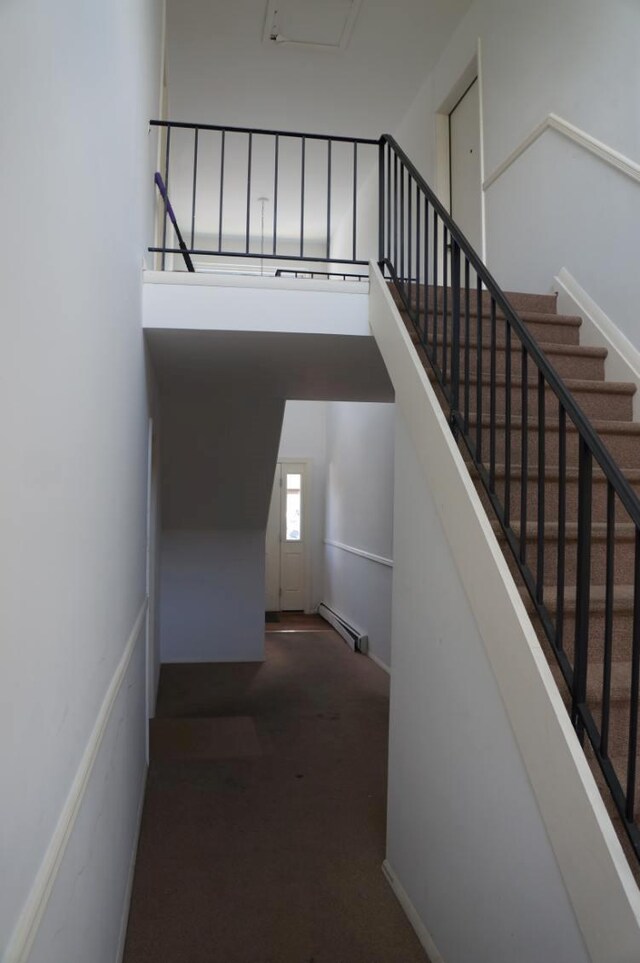 1115 Cherry Hill Dr, Poughkeepsie, NY 12603 - staircase with baseboard heating and carpet flooring