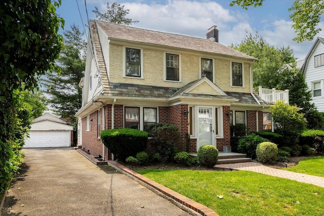 265 Brower Ave, Rockville Centre, NY 11570 - view of front of property with an outdoor structure, a chimney, brick siding, and a front lawn