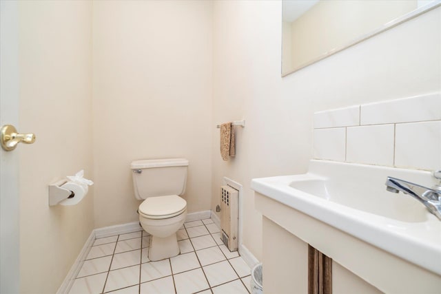 265 Brower Ave, Rockville Centre, NY 11570 - bathroom with tile patterned floors, radiator heating unit, and vanity