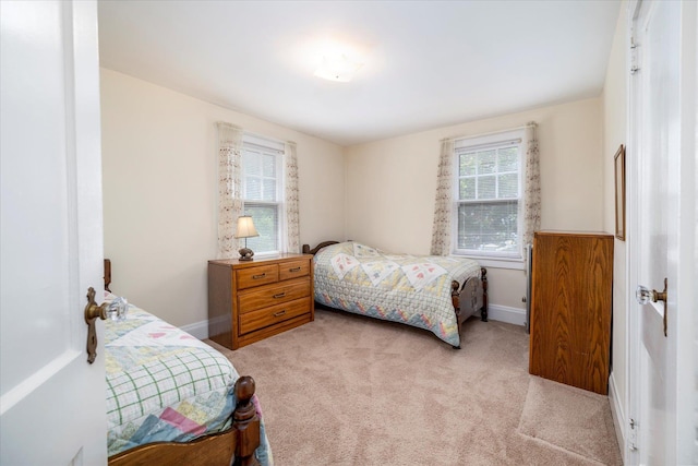 265 Brower Ave, Rockville Centre, NY 11570 - bedroom with light carpet and baseboards