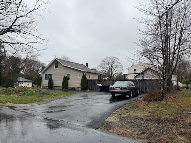 3 Ocean Ave, Mastic, NY 11950 - view of side of home featuring driveway and fence