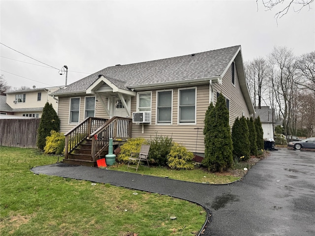 3 Ocean Ave, Mastic, NY 11950 - bungalow-style home featuring a shingled roof and cooling unit