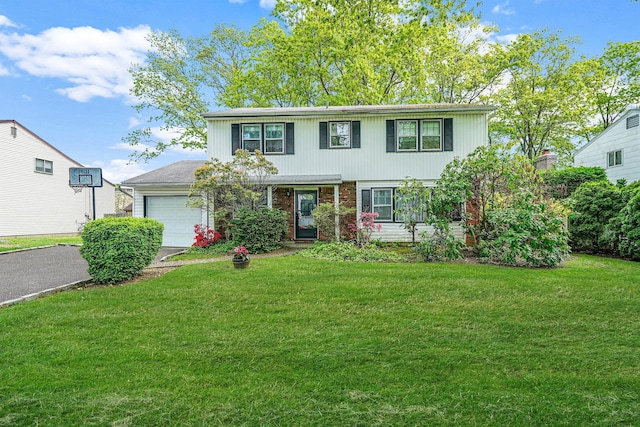 39 Pinewood Dr, Commack, NY 11725 - view of front of house featuring an attached garage, a front yard, asphalt driveway, and brick siding