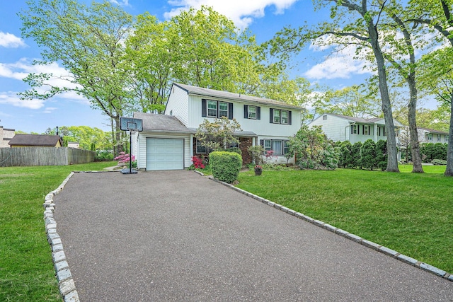 39 Pinewood Dr, Commack, NY 11725 - view of front of home with an attached garage and asphalt driveway