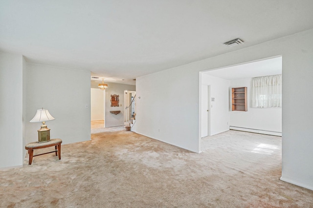 39 Pinewood Dr, Commack, NY 11725 - unfurnished living room with a baseboard heating unit, carpet, stairway, and a chandelier