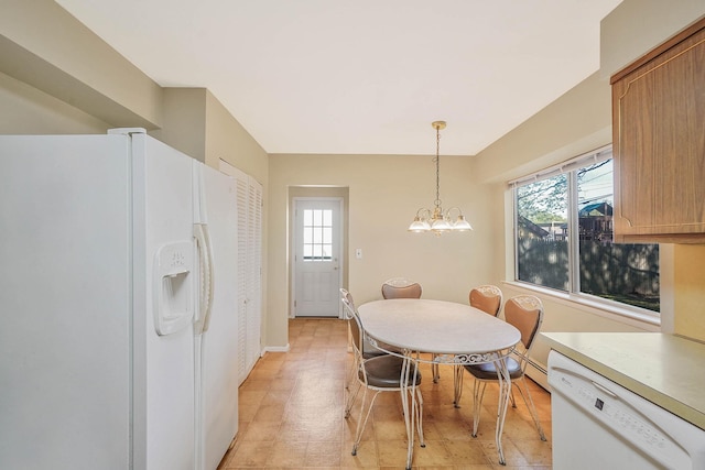 39 Pinewood Dr, Commack, NY 11725 - dining space featuring a chandelier, light floors, and baseboards