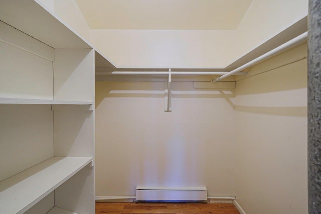 39 Pinewood Dr, Commack, NY 11725 - spacious closet with baseboard heating and wood finished floors