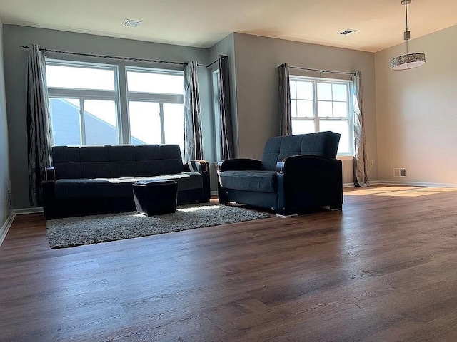162 Commodore Cir E, Arverne, NY 11692 - living room featuring wood finished floors and baseboards