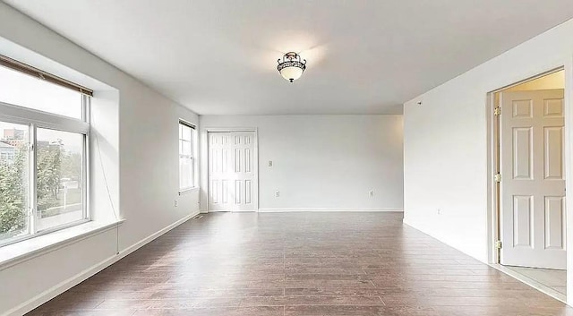 162 Commodore Cir E, Arverne, NY 11692 - unfurnished room featuring wood finished floors and baseboards