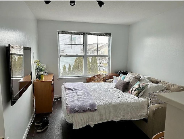 162 Commodore Cir E, Arverne, NY 11692 - bedroom with dark wood finished floors and baseboards