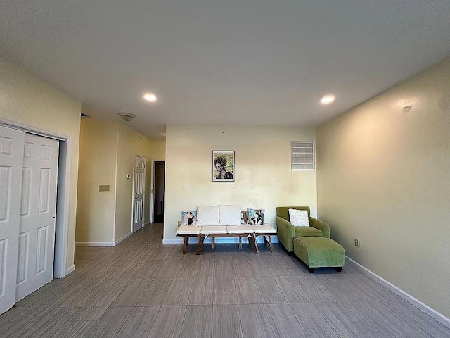 162 Commodore Cir E, Arverne, NY 11692 - living area with wood finished floors, recessed lighting, and baseboards