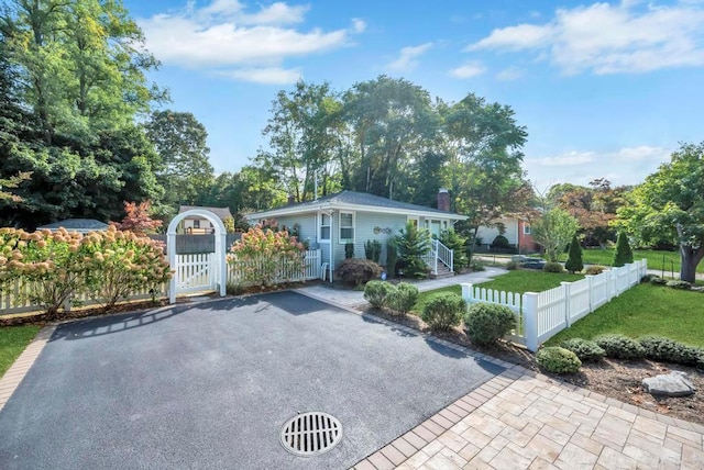 115 19th St, Wading River, NY 11792 - view of front of home featuring a gate and a chimney