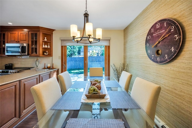 115 19th St, Wading River, NY 11792 - dining space featuring a chandelier