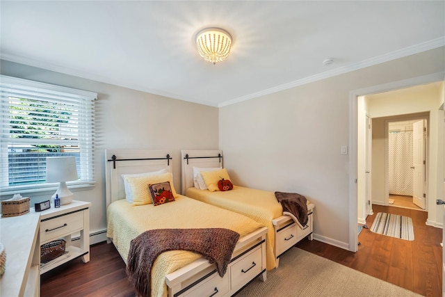 115 19th St, Wading River, NY 11792 - bedroom featuring crown molding, dark wood finished floors, baseboards, and a baseboard heating unit