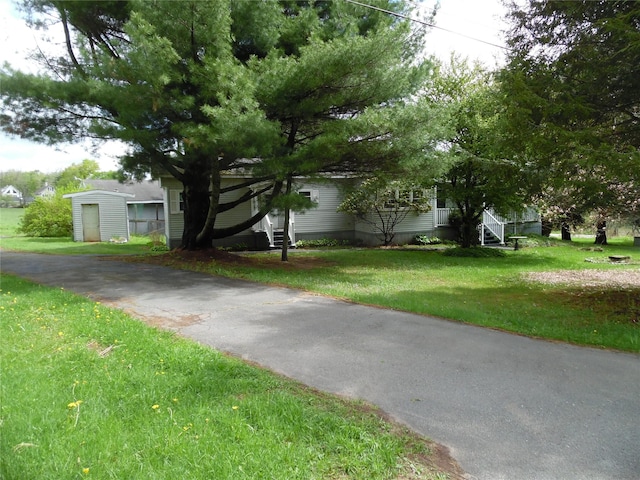8 Crumley Van Vactor Rd, Ferndale, NY 12734 - view of front of home with a front yard and asphalt driveway