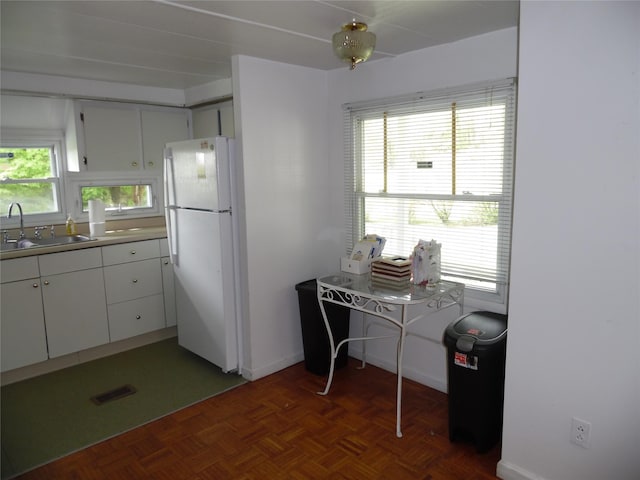 8 Crumley Van Vactor Rd, Ferndale, NY 12734 - kitchen with freestanding refrigerator, a sink, and white cabinets
