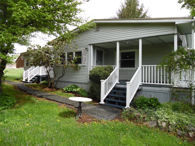8 Crumley Van Vactor Rd, Ferndale, NY 12734 - bungalow-style house featuring covered porch, stairs, and a front lawn