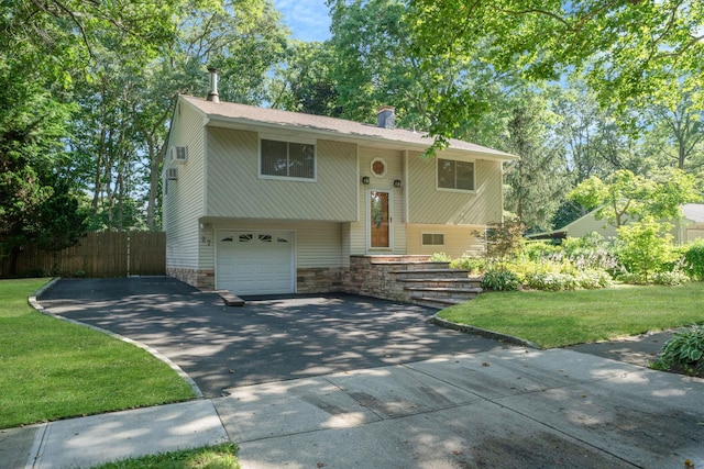 27 Columbus Ave, Kings Park, NY 11754 - bi-level home with concrete driveway, an attached garage, and a chimney
