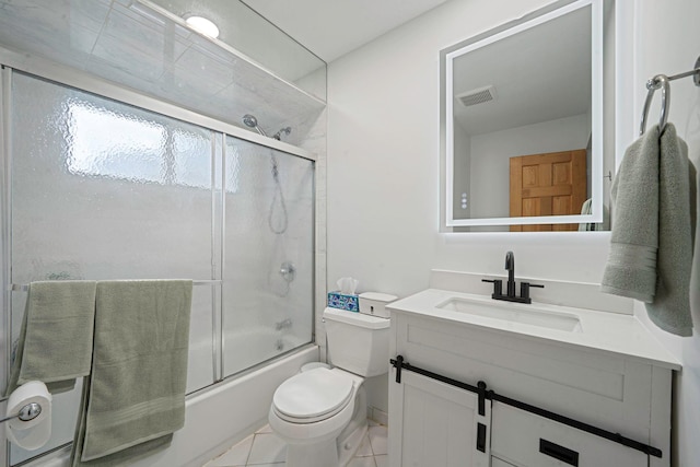 27 Columbus Ave, Kings Park, NY 11754 - bathroom featuring vanity, shower / bath combination with glass door, and tile patterned floors