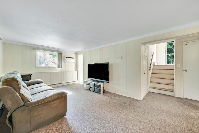 27 Columbus Ave, Kings Park, NY 11754 - living room featuring carpet floors, stairs, a wall mounted air conditioner, ornamental molding, and wooden walls