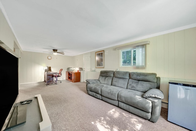 27 Columbus Ave, Kings Park, NY 11754 - carpeted living area featuring crown molding, ceiling fan, and a baseboard heating unit