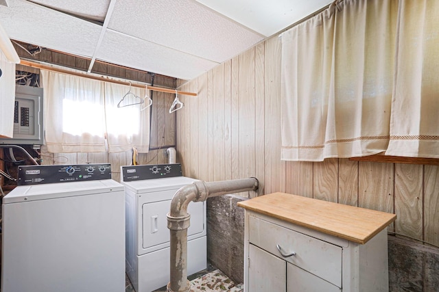 27 Columbus Ave, Kings Park, NY 11754 - laundry area with washing machine and clothes dryer, wood walls, cabinet space, and electric panel